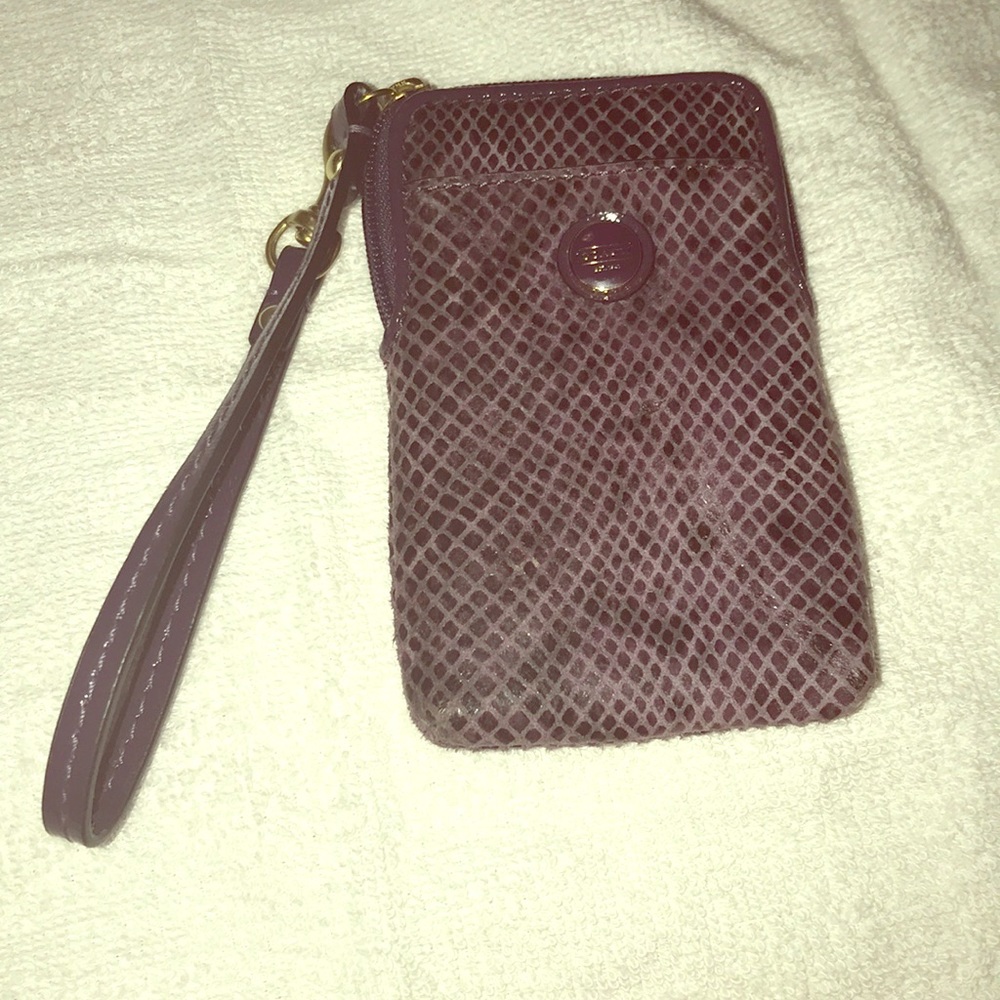 Coach never use  little wristlet . Has few pockets